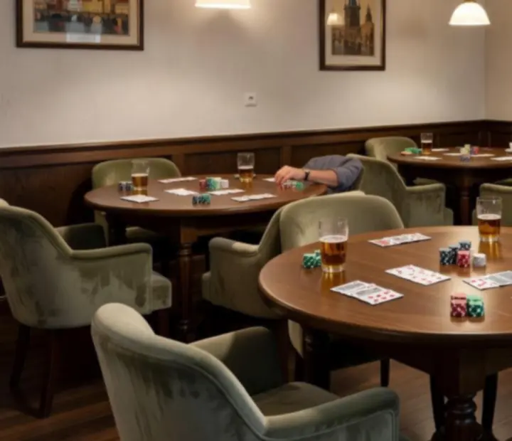 Warm, intimate poker room with custom wooden card tables