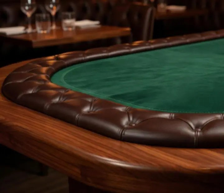 Custom-crafted wooden poker table with padded edge and neatly stacked chips.